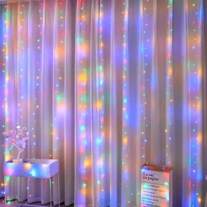 TwinkleVeil LED Drapes - Yelopi - Multicolor variant with lights on in a living room window